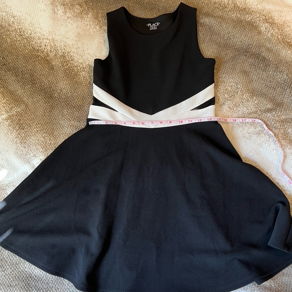 Children’s place black with white dress with mesh detail on waist. Size 14 Girls
